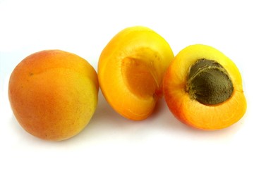 Fresh apricots on white background.