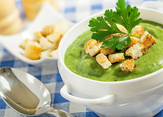 Cream soup and dried crusts on the table, studio shot