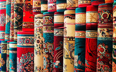 Persian blankets at a market - obrazy, fototapety, plakaty