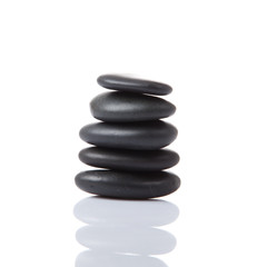 Black stones isolated on white background. Balancing Stones