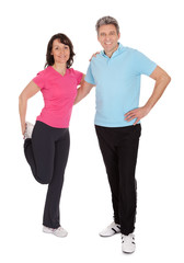 Active mature couple doing fitness