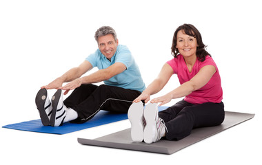 Active mature couple doing fitness