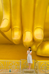 Woman pay Respect Golden Buddha statue