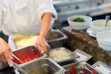 Hands working in kitchen