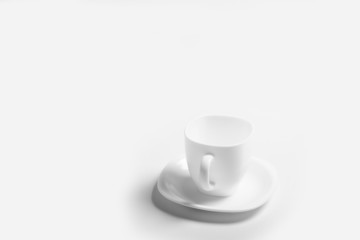 white cup with white saucer