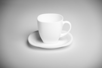 white cup with white saucer