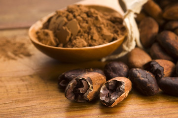 Cocoa (cacao) beans on natural wooden table