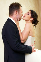 bride and groom hugging in empty room