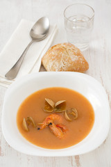 soup with seafood in white plate