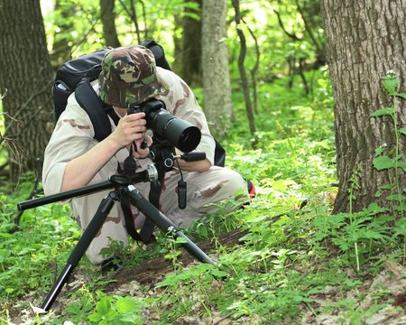 Wildlife Photographer In Light Camouflage