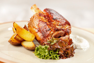 roasted pork knuckle with potatoes