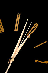 black wall clock, two minutes to twelve