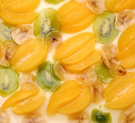 Fresh apricot cake with banana and kiwi