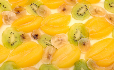 Fresh apricot cake with banana and kiwi