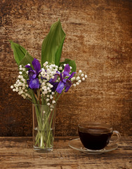 Still-life bouquet of lily of the valley  with blue irises