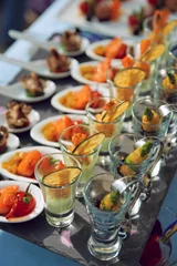 Fotobehang Spoons and glasses with seafood snacks © Kondor83