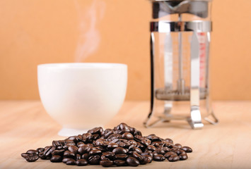 Coffee bean, cup and french press