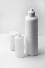 White plastic bottles on white