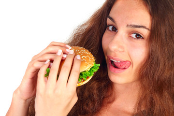 Young woman eating hamburger