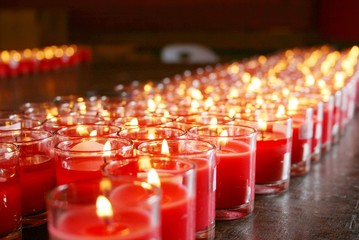 red burning candles in a temple - 42165532