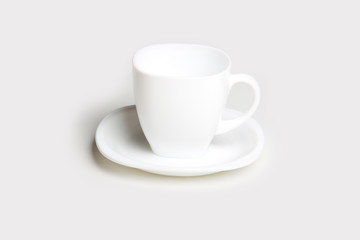 white cup with white saucer