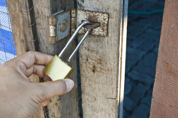 Conceptual image of hand and lock