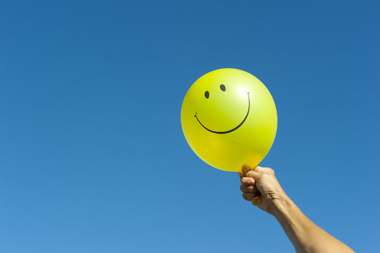 Arm With Happy Smiley Balloon