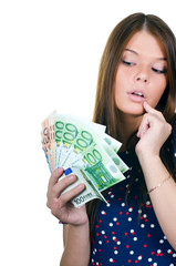 The beautiful girl with euro banknotes