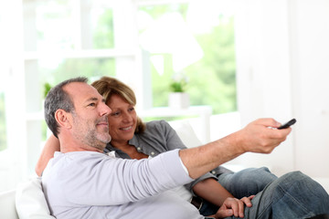 Fototapeta premium Senior couple watching television at home