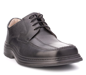 Black glossy man’s shoe with shoelaces