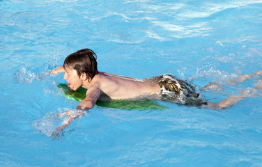 boy swimming in the pool