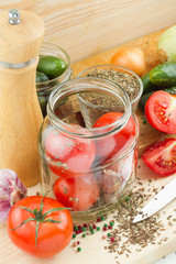 canned tomatoes and cucumbers, homemade preserved vegetables