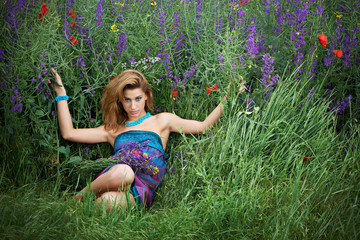 Pretty girl in spring meadow