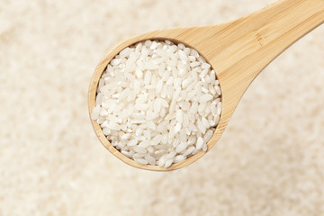Healthy Dry Brown Rice in a spoon