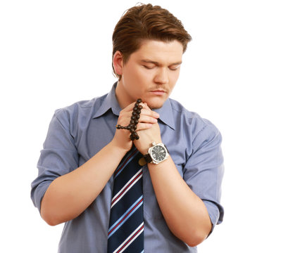 A portrait of a praying man isolated on white
