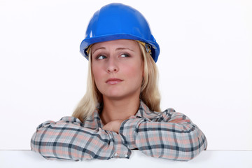 Female builder with confused look on her face