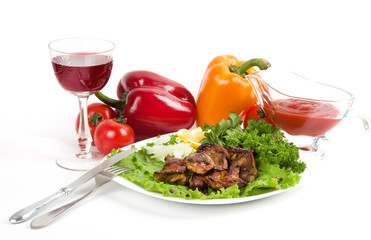 Appetizing weal kebab on skewers with tomatoes, pepper, wine