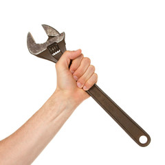 Old rusted adjustable vector wrench in a hand