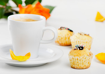 Coffee cup and muffins