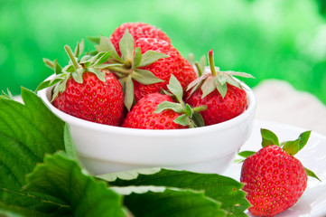Fresh strawberries in white bowl
