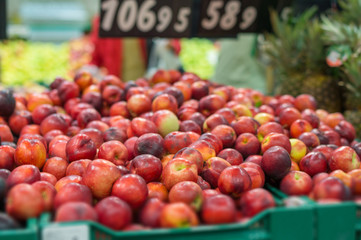 Variety of nectarines in boxes in supermarket