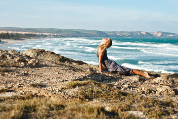 Fototapeta na wymiar Young woman doing yoga.Upward facing dog pose