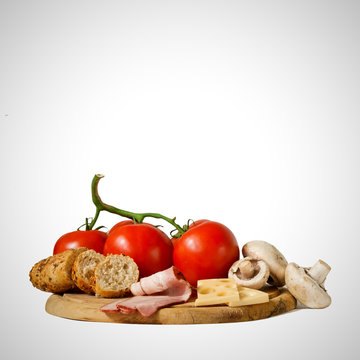 Food on wooden board isolated