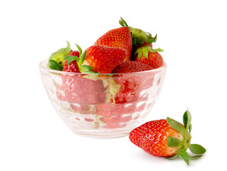 Strawberries in a glass bowl on a white background