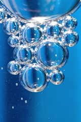 Blue bubbles in clear water.