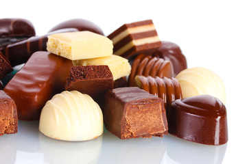 Many different chocolate candy isolated on white