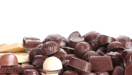 Many different chocolate candy isolated on white