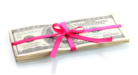 A lot of one hundred dollar bills tied pink ribbon isolated