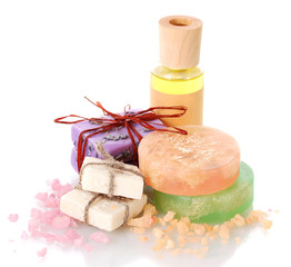 bottle with oil, soaps and sea salt isolated on white