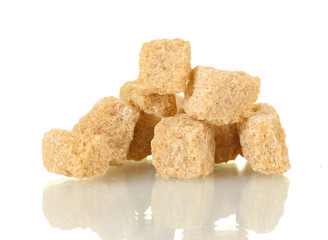 brown cane sugar cubes isolated on white